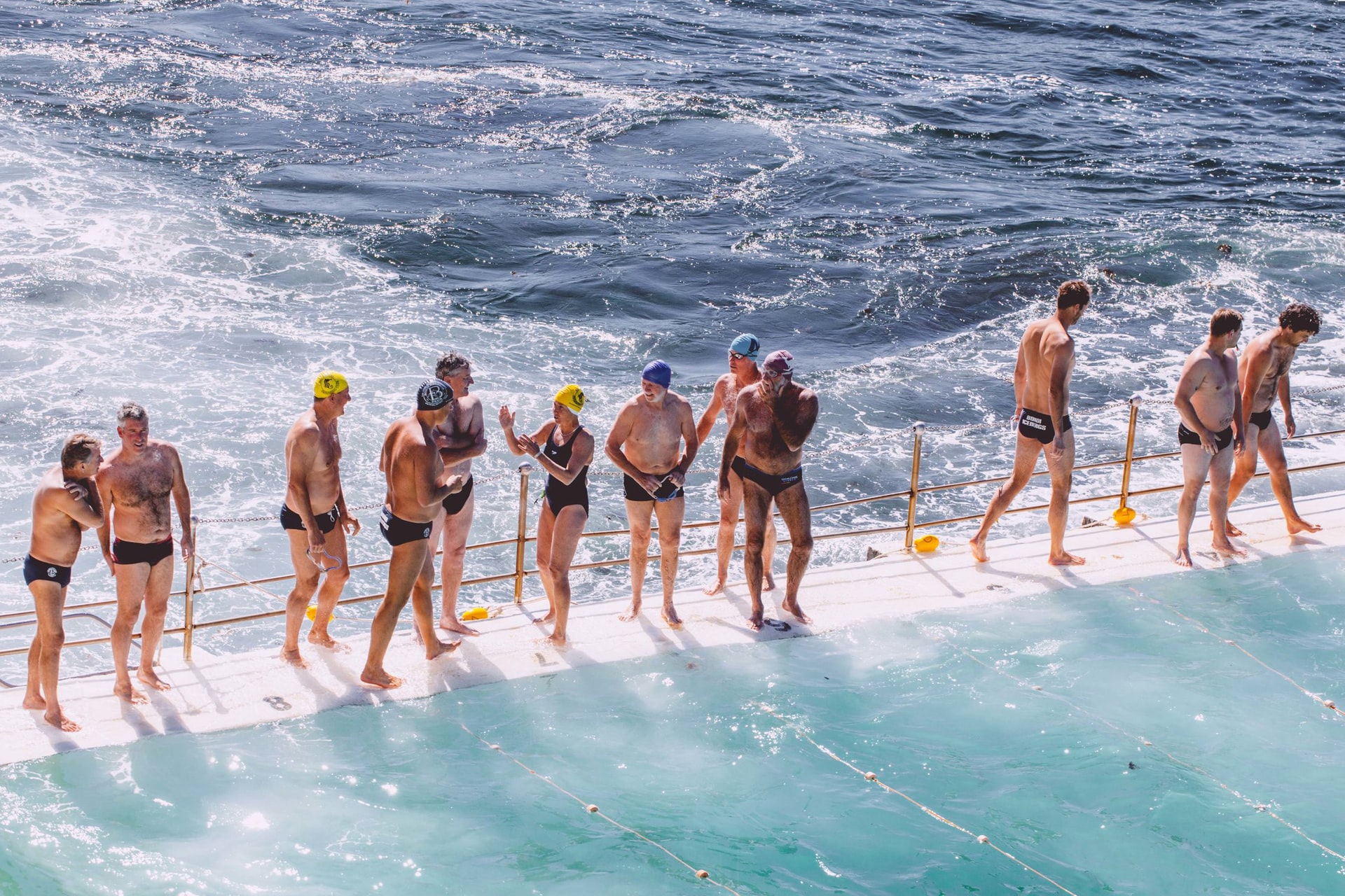 Self-care resolutions blog - swimmers standing on edge of ocean pool