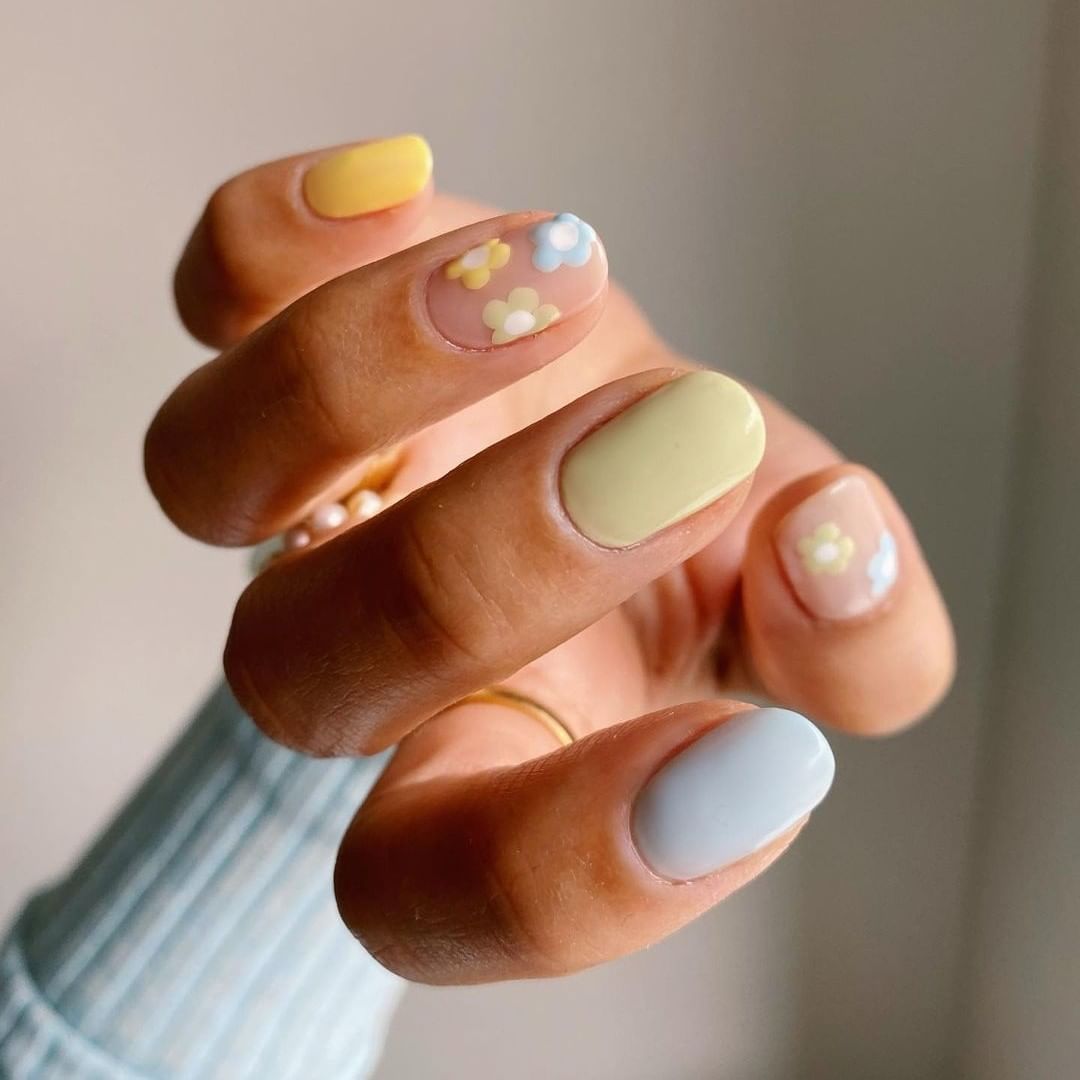 green, blue and yellow short manicure with flowers