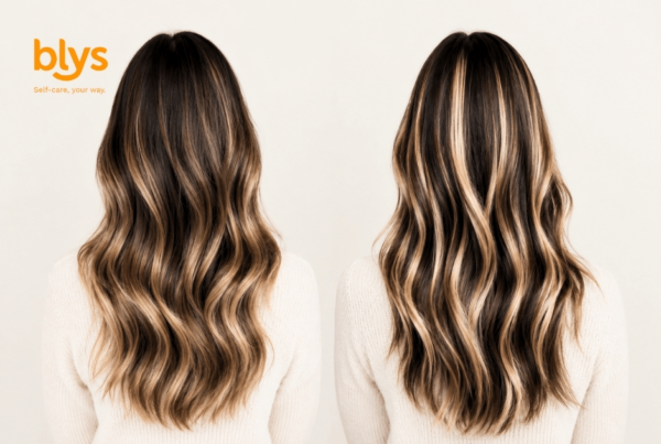 Side-by-side rear view of two women with long, wavy brunette hair featuring one with warm caramel balayage and the other in highlights, styled in glossy, flowing layers.