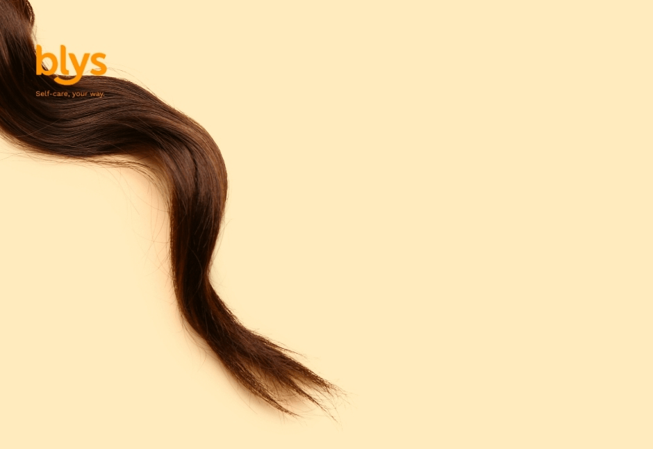 Minimalist Blys wellness graphic: flowing dark brown hair with medium porosity curves across a warm cream background beneath the orange “blys” logo, creating a calm, elegant mood.